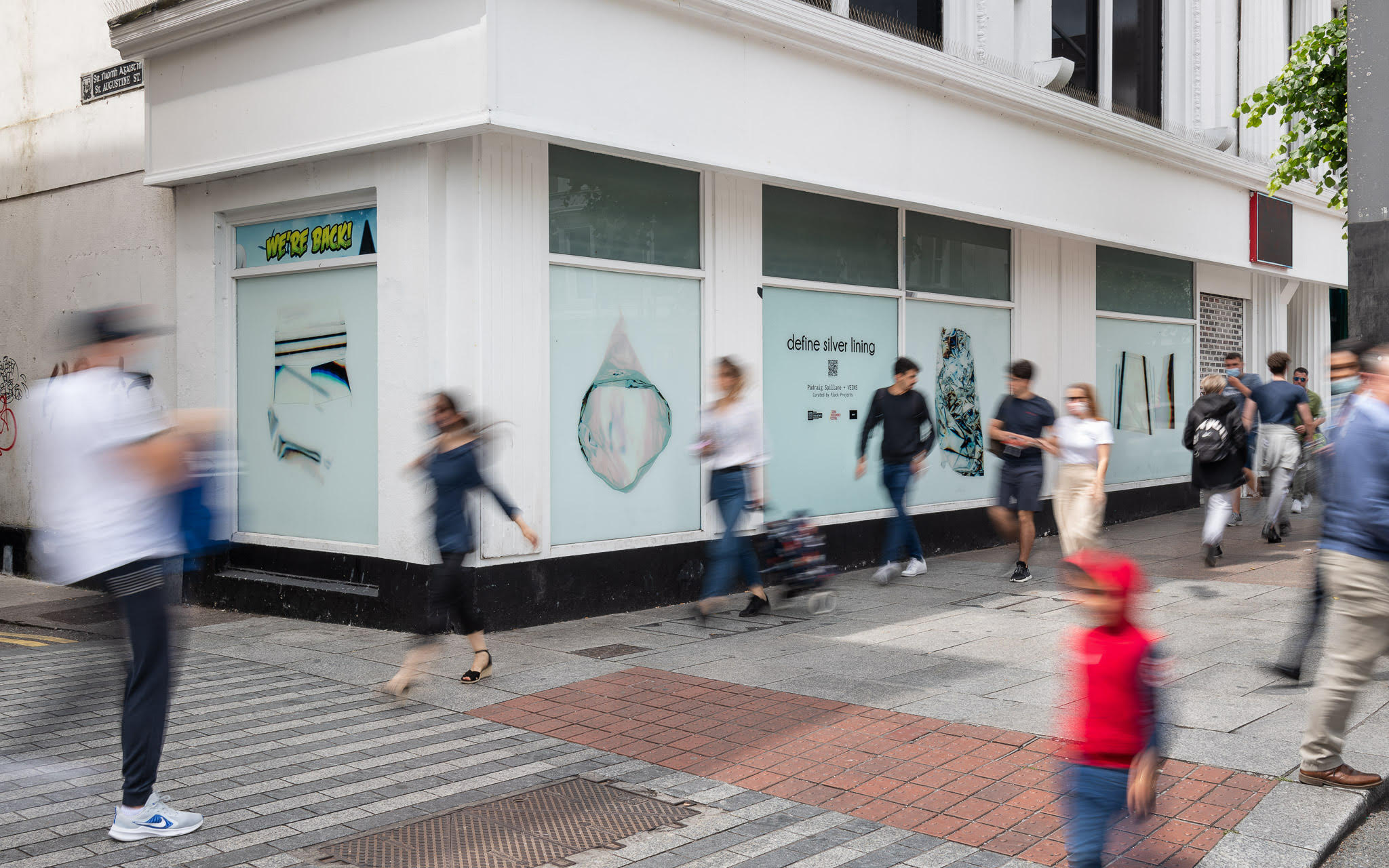 Photograph of the define silver lining installation displayed in shop windows