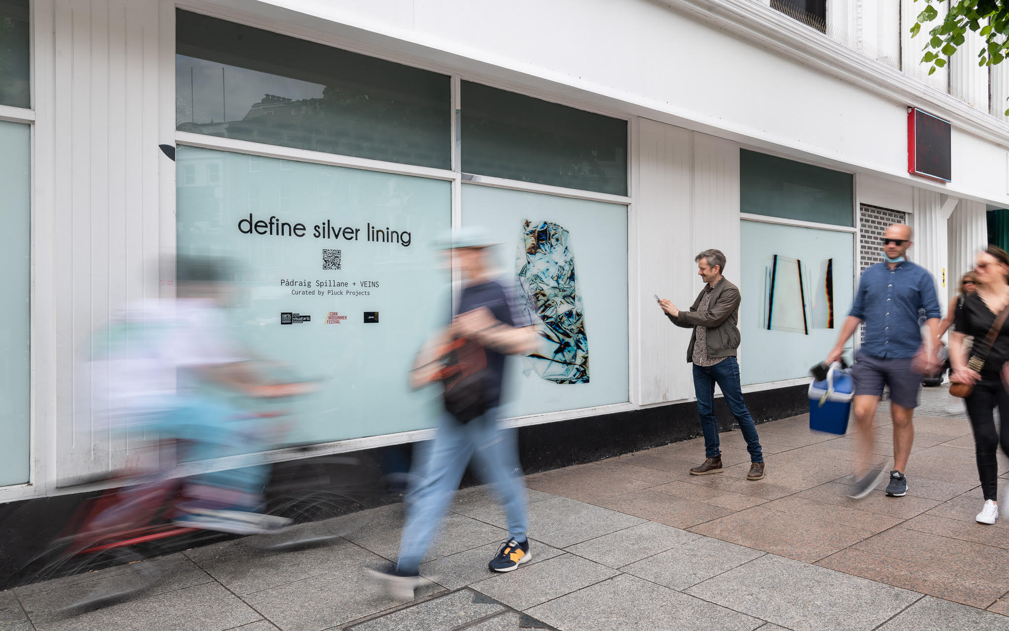 Photograph of the define silver lining installation displayed in shop windows