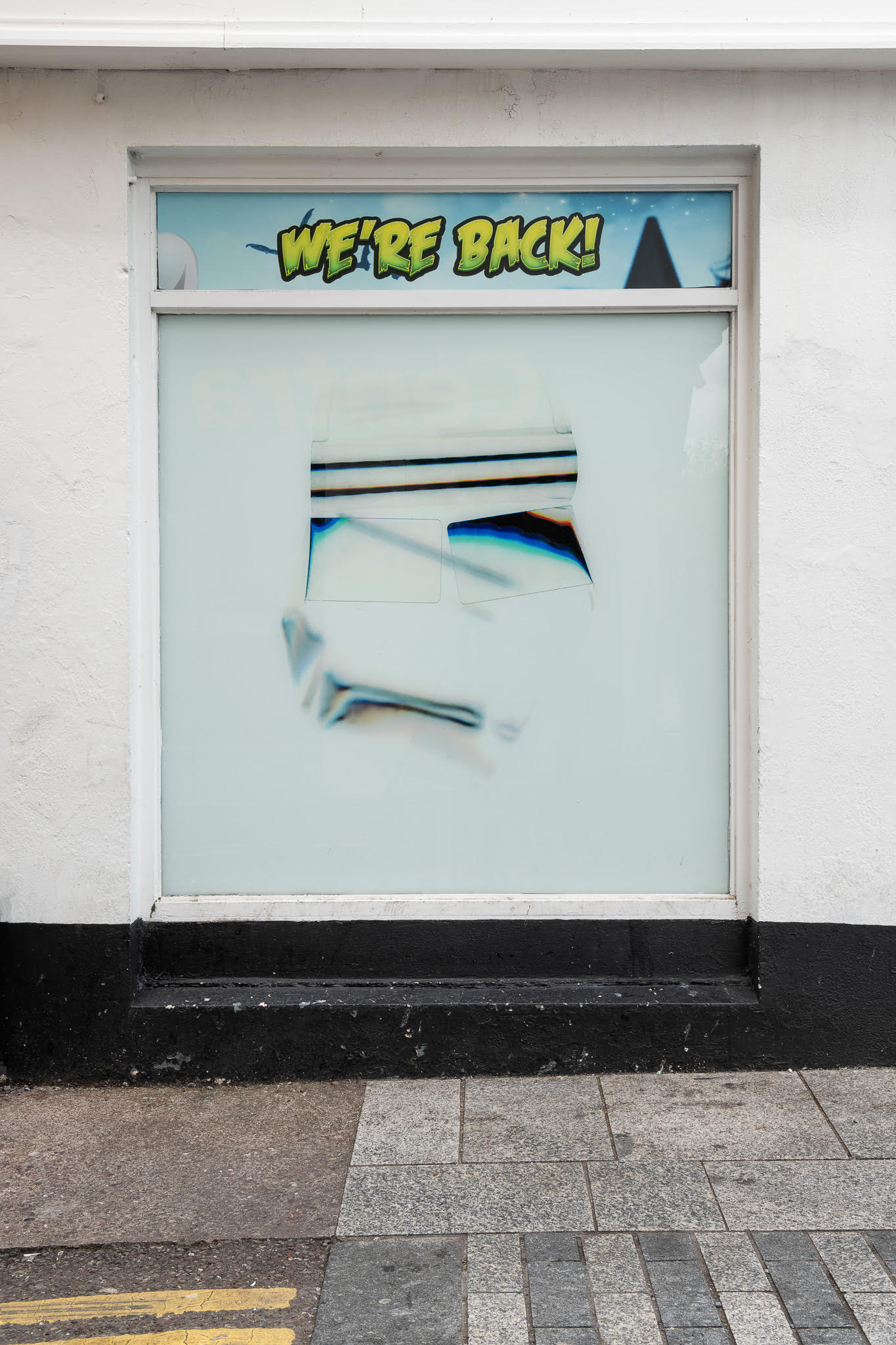 Photograph of the define silver lining installation displayed in shop windows