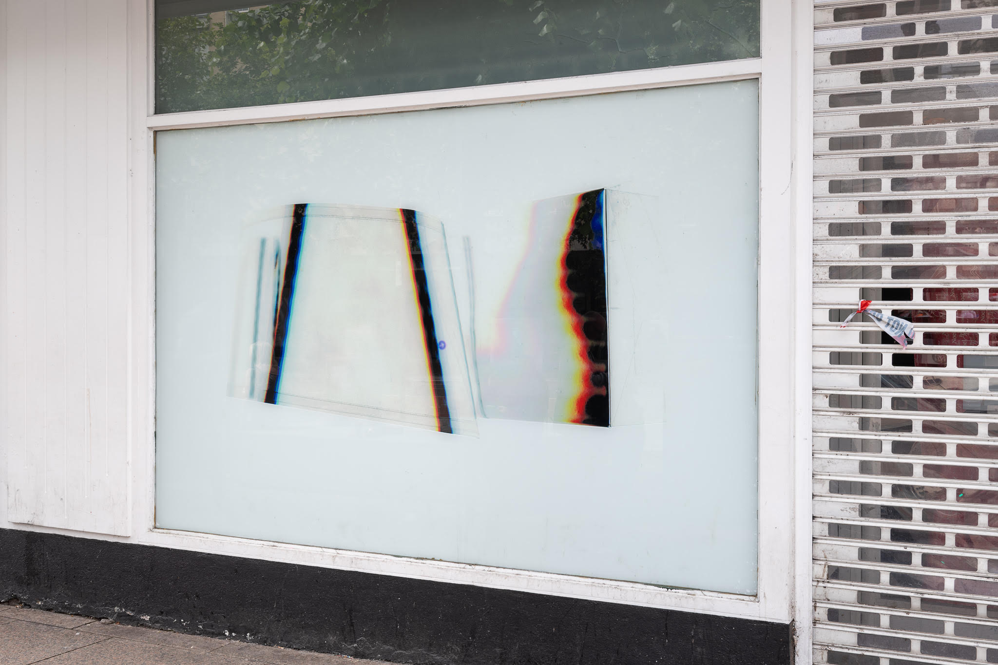 Photograph of the define silver lining installation displayed in shop windows