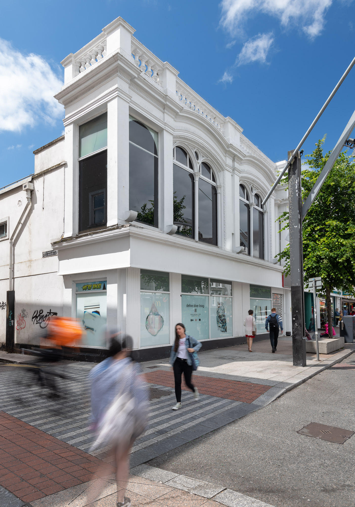 Photograph of the define silver lining installation displayed in shop windows